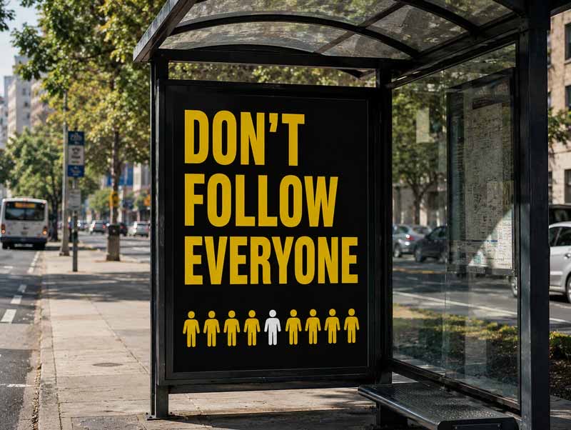 Don't Follow Everyone poster at a bus stop